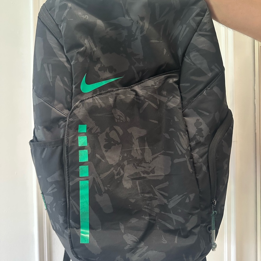 Nike Black and Green Athletic Backpack with Modern Design